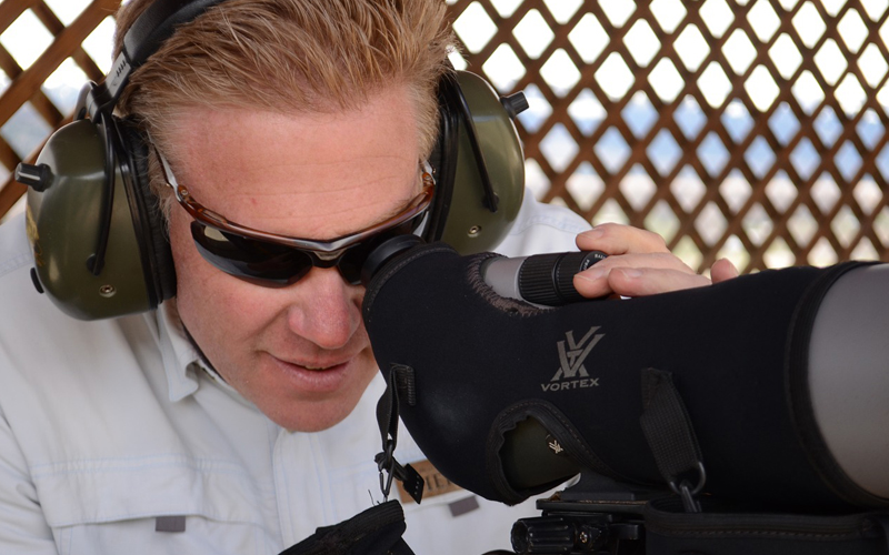 spotting scope use by a man