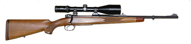 Brown hunting rifle with a black scope