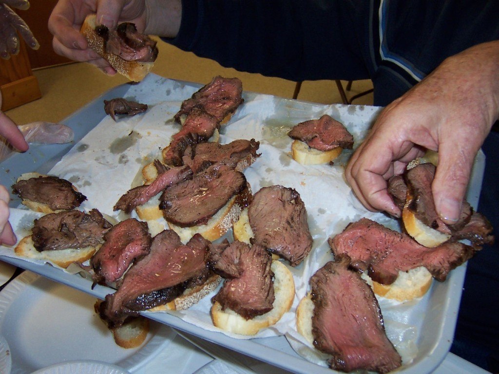 Medium rare sliced meat on bread