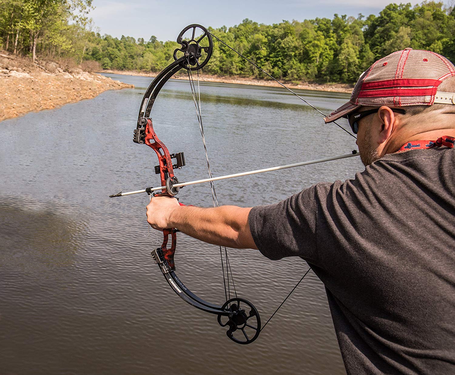 man practice using a crossbow