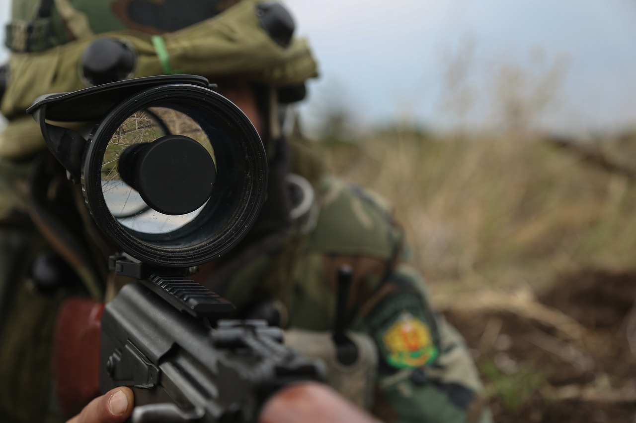 Soldier aiming a target in the scope